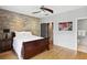 Cozy bedroom with exposed brick accent wall and access to ensuite bathroom at 1323 Peachtree Ne Vw, Atlanta, GA 30319