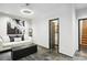 Cozy living room with tile floors, neutral sofa, modern art, and interior access at 1323 Peachtree Ne Vw, Atlanta, GA 30319