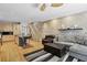 Living room featuring exposed brick wall, hardwood floors, and comfortable seating area at 1323 Peachtree Ne Vw, Atlanta, GA 30319