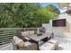 Inviting outdoor patio with comfortable seating, grill, and mounted television at 1323 Peachtree Ne Vw, Atlanta, GA 30319