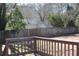 View of fenced backyard bordered by wooden fence and mature trees, seen from deck at 2031 Lakewood Cir, Grayson, GA 30017