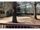 Expansive backyard view from deck, bordered by wooden fence and mature trees at 2031 Lakewood Cir, Grayson, GA 30017