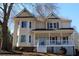 Charming two-story home with welcoming front porch and gable roof accents at 2031 Lakewood Cir, Grayson, GA 30017