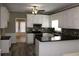 Modern kitchen featuring white cabinets, granite countertops, and a tiled backsplash at 2031 Lakewood Cir, Grayson, GA 30017