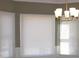 Bright room with multiple windows and modern window coverings at 2031 Lakewood Cir, Grayson, GA 30017