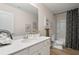 Well-lit bathroom featuring a modern vanity, large mirror, and shower/tub combo at 7 Camellia Dr, Fairburn, GA 30213