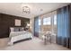 Bedroom with three windows, decorative accent wall, and carpet floors at 7 Camellia Dr, Fairburn, GA 30213