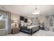 Bright bedroom featuring a comfortable bed, natural light, and stylish decor at 7 Camellia Dr, Fairburn, GA 30213