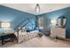 Blue bedroom with carpet floors, modern lamps, and large dresser at 7 Camellia Dr, Fairburn, GA 30213