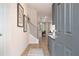 Inviting entryway with wood floors, staircase, modern decor, and views to open-concept living spaces at 7 Camellia Dr, Fairburn, GA 30213