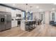 Open-concept kitchen with stainless steel appliances, a large island, and a view of the dining area at 7 Camellia Dr, Fairburn, GA 30213