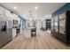 Modern kitchen with stainless steel appliances, a large island, and open layout to the living room at 7 Camellia Dr, Fairburn, GA 30213