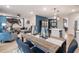 Bright living area with open floor plan, stylish furnishings and decor, and seamless connection to other living spaces at 7 Camellia Dr, Fairburn, GA 30213
