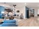 Open living room featuring a comfortable sectional sofa, modern decor, and plenty of natural light, ideal for relaxation at 7 Camellia Dr, Fairburn, GA 30213