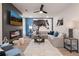 Cozy living room with a fireplace, large sectional, and modern decor, perfect for relaxation and entertaining at 7 Camellia Dr, Fairburn, GA 30213