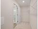 A simple, functional walk-in closet with ample wire shelving and neutral carpeting at 7 Camellia Dr, Fairburn, GA 30213