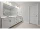 Bathroom featuring double vanity, large mirror, and tile flooring at 730 Lanarck Way, Peachtree City, GA 30269