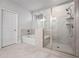 Bathroom featuring a tub and a separate glass shower with tile surround, and a tiled floor at 730 Lanarck Way, Peachtree City, GA 30269