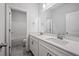Bathroom featuring double sink vanity, sleek white countertop, and shower and tub combo at 730 Lanarck Way, Peachtree City, GA 30269