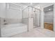 Bathroom features a soaking tub and glass enclosed shower at 730 Lanarck Way, Peachtree City, GA 30269
