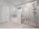 Bathroom features a bathtub and glass-enclosed shower at 730 Lanarck Way, Peachtree City, GA 30269