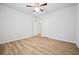 Neutral bedroom features wood floors with an open door at 730 Lanarck Way, Peachtree City, GA 30269