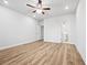 Spacious bedroom features wood floors, a ceiling fan, and an ensuite bathroom at 730 Lanarck Way, Peachtree City, GA 30269