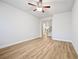 Clean and bright bedroom with wood flooring and a ceiling fan at 730 Lanarck Way, Peachtree City, GA 30269