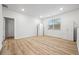 Bright bedroom with wood-look flooring, natural light, and built-in storage cabinets at 730 Lanarck Way, Peachtree City, GA 30269