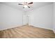 Bedroom with ceiling fan, flooring, and large windows at 730 Lanarck Way, Peachtree City, GA 30269
