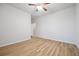 Bright bedroom with ceiling fan and light, features attractive floors at 730 Lanarck Way, Peachtree City, GA 30269