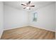 Bright bedroom with light wood-look floors and a ceiling fan at 730 Lanarck Way, Peachtree City, GA 30269