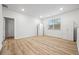 Bright bedroom with wood flooring, a window, and built-in storage at 730 Lanarck Way, Peachtree City, GA 30269