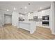 Modern kitchen features white cabinets, stainless steel appliances, and a large center island at 730 Lanarck Way, Peachtree City, GA 30269