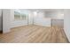An open loft area with hardwood flooring, window, and storage space at 730 Lanarck Way, Peachtree City, GA 30269