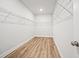 Walk-in closet features wood floors and wire shelving at 730 Lanarck Way, Peachtree City, GA 30269
