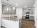 Modern kitchen features granite countertops, stainless steel appliances, and ample cabinet space at 748 Great Oak Pl, Villa Rica, GA 30180