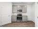 Well-lit kitchen featuring modern appliances, gray cabinets, and sleek countertops at 748 Great Oak Pl, Villa Rica, GA 30180