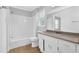 Bright bathroom with a large vanity, ample storage space, tub and shower combo, and neutral tones at 1111 Louise Se Ct, Conyers, GA 30013
