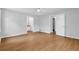 Spacious bedroom with wood floors, neutral paint, ceiling fan and ensuite bath at 1111 Louise Se Ct, Conyers, GA 30013
