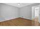Clean bedroom with light-gray walls, and laminate flooring at 1111 Louise Se Ct, Conyers, GA 30013