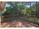 A wood deck overlooks a backyard area at 1111 Louise Se Ct, Conyers, GA 30013