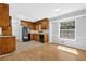 Functional kitchen with wooden cabinets and appliances, enhanced by bright lighting at 1111 Louise Se Ct, Conyers, GA 30013