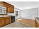Kitchen area with wooden cabinets and view of the window at 1111 Louise Se Ct, Conyers, GA 30013