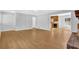 Open-concept living room showcasing hardwood floors and neutral wall colors at 1111 Louise Se Ct, Conyers, GA 30013