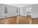 Bright main bedroom with laminate flooring and connecting bathroom at 1111 Louise Se Ct, Conyers, GA 30013