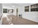 Bright sunroom with tiled floors, multiple windows, and access to the outdoors at 1111 Louise Se Ct, Conyers, GA 30013