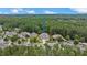 Drone view of the home nestled in a forested neighborhood at 4216 Tattnall Run, Acworth, GA 30101