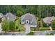 Stunning aerial view of home with lush landscaping, mature trees, and circular driveway at 4216 Tattnall Run, Acworth, GA 30101