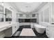Elegant bathroom with dual sinks, white countertops, hexagon floors, and a modern soaking tub at 4216 Tattnall Run, Acworth, GA 30101